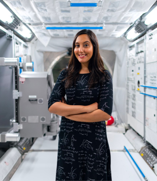 Woman posing in the interior of a rocketship