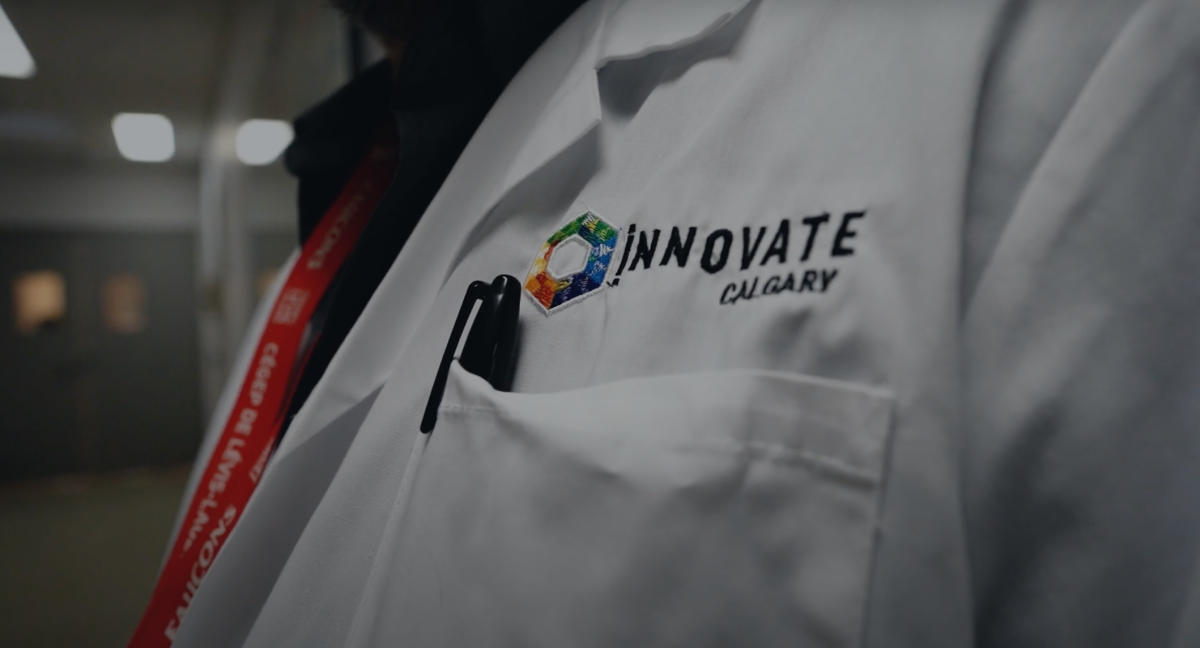 A lab coat with an Innovate Calgary embroidered onto it
